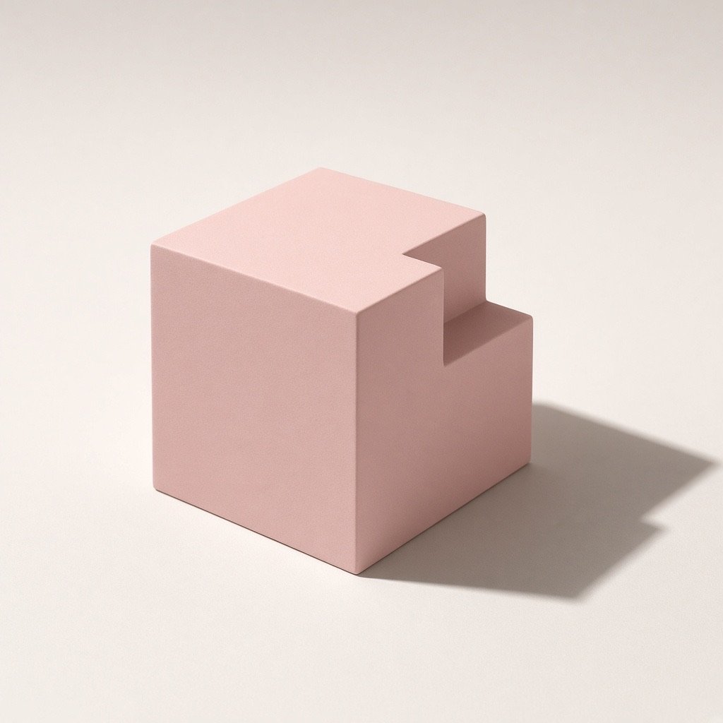 A powder-rose geometric volume photographed in an empty studio, used as the site’s first object.
